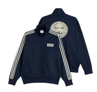 Cappotto Oasis x Adidas 2025